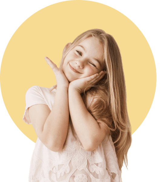 Smiling girl resting her head on her hands in Babies Bloomers sleepwear